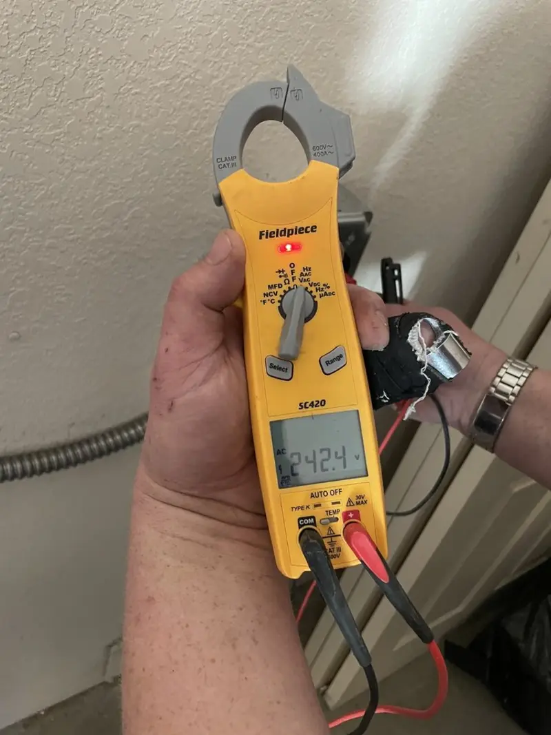 Voltage testing with clamp meter during Generator Installation in Demopolis